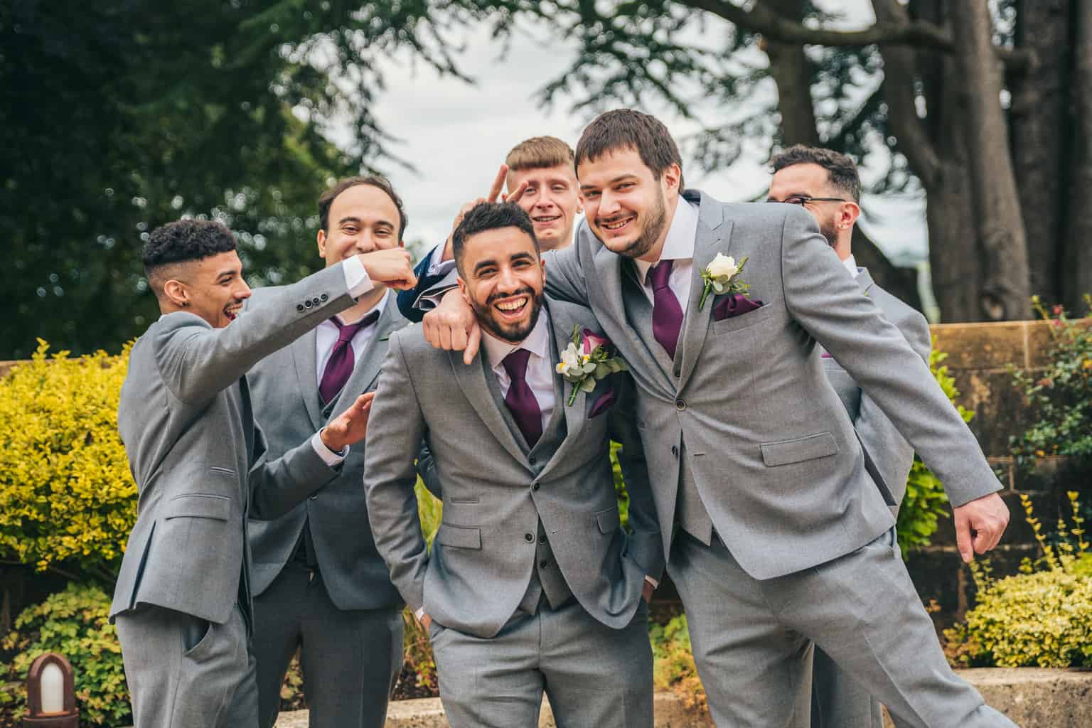 Groom and groomsmen, relaxed, fun, wedding photography at Coombe Lodge