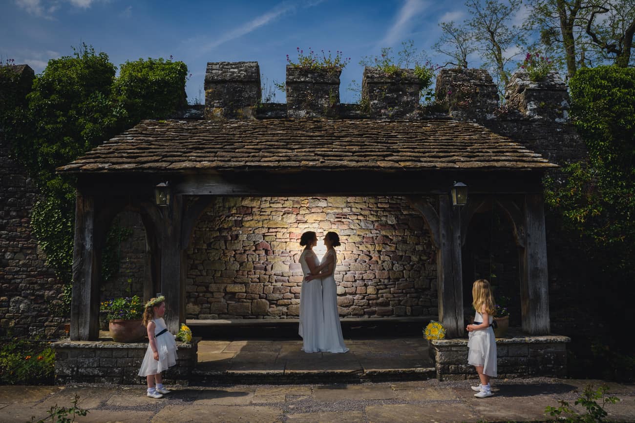 Same-sex creative wedding photography 2 brides at Thornbury Castle